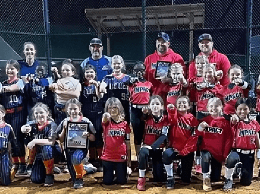 Youth softball teams posing with trophies