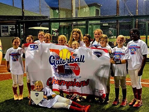 Youth softball team celebrating championship victory.
