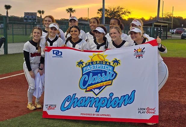 Girls softball team holding champions banner
