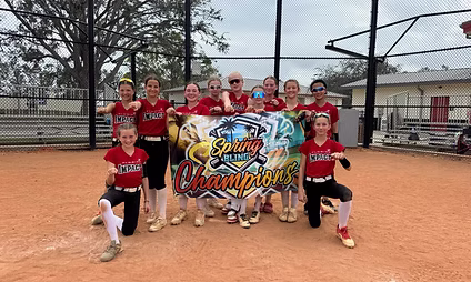 Youth softball team with championship banner