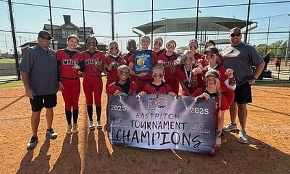 Softball team celebrating tournament victory on field.