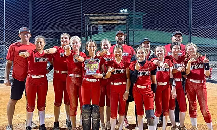Softball team celebrating victory on the field.