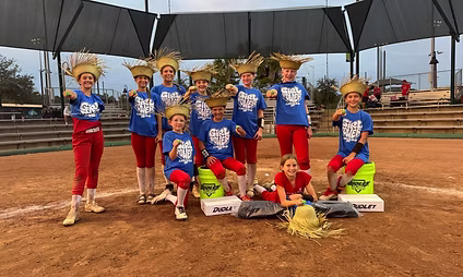 Softball team in uniforms with straw hats.