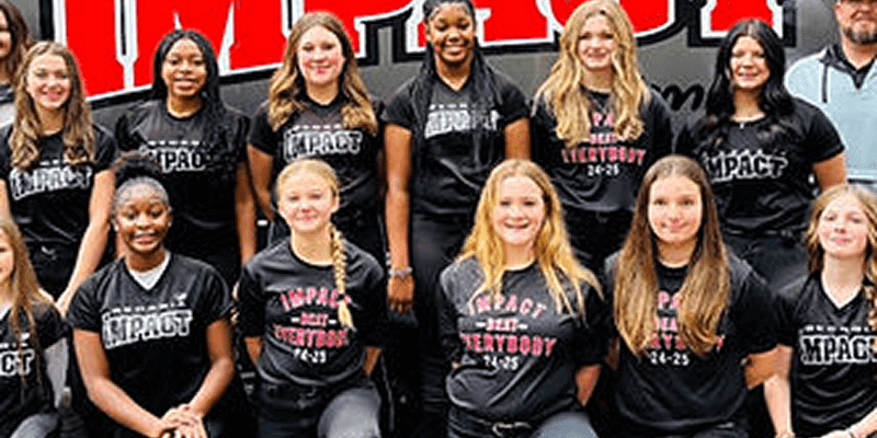 Group of people in matching sports shirts.