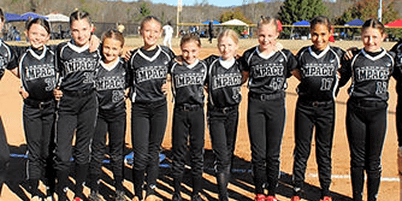 Youth girls softball team in black uniforms
