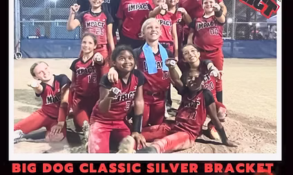 Youth softball team celebrating on field.