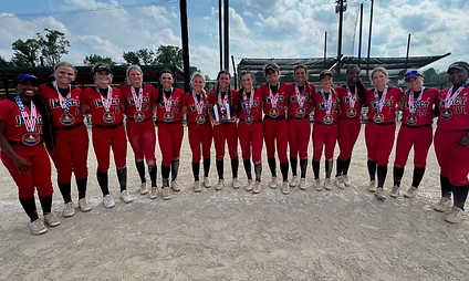 Softball team in red uniforms with medals