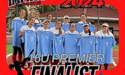 Girls' softball team holding finalist shirts.