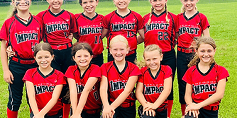 Youth softball team in red Impact jerseys