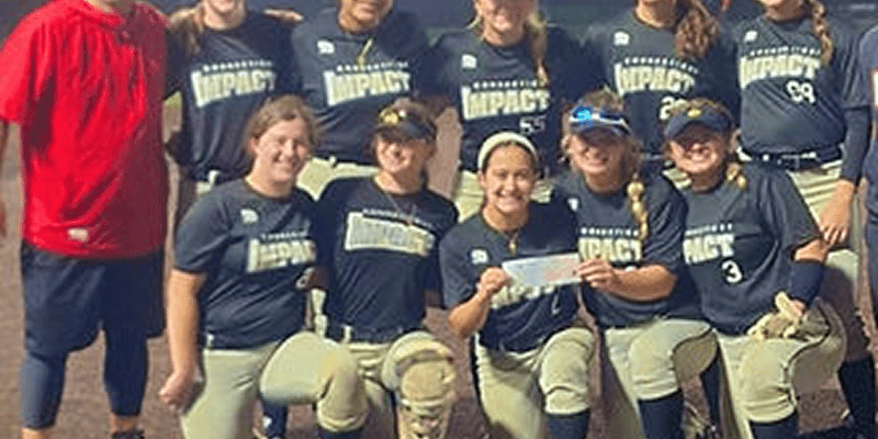 Softball team posing with a certificate.