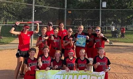 Youth softball team in red uniforms celebrating championship