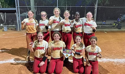 Youth softball team posing with plaque