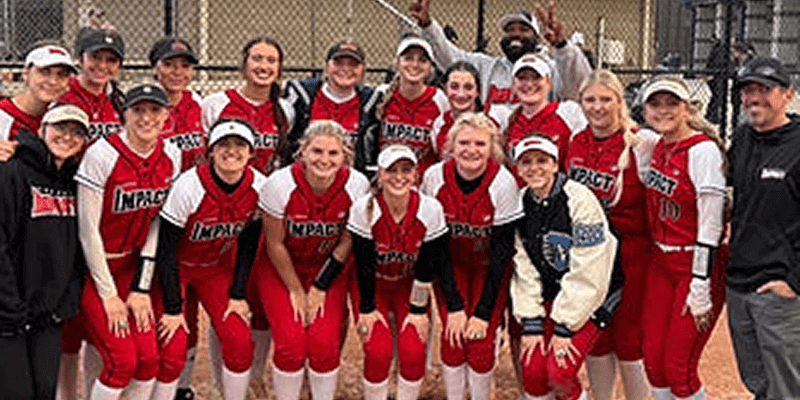 Softball team posing for a group photo.