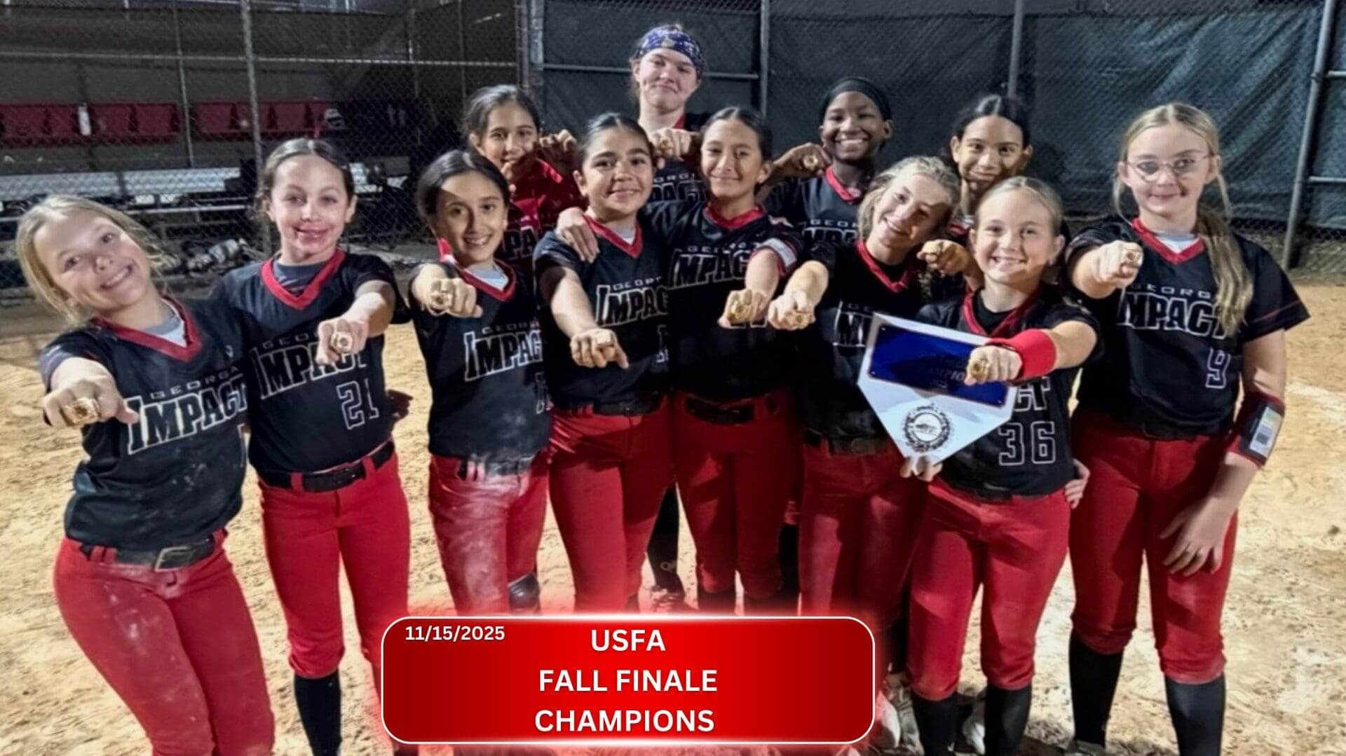 A jubilant women's softball team celebrating their USA Fall Finale Championship victory.