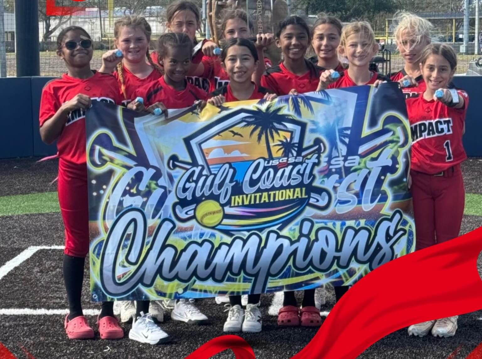 Youth football team proudly holding their championship banner.