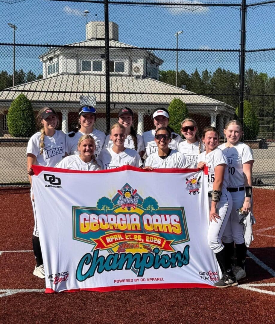 Girls softball team holding Georgia Oaks champions banner